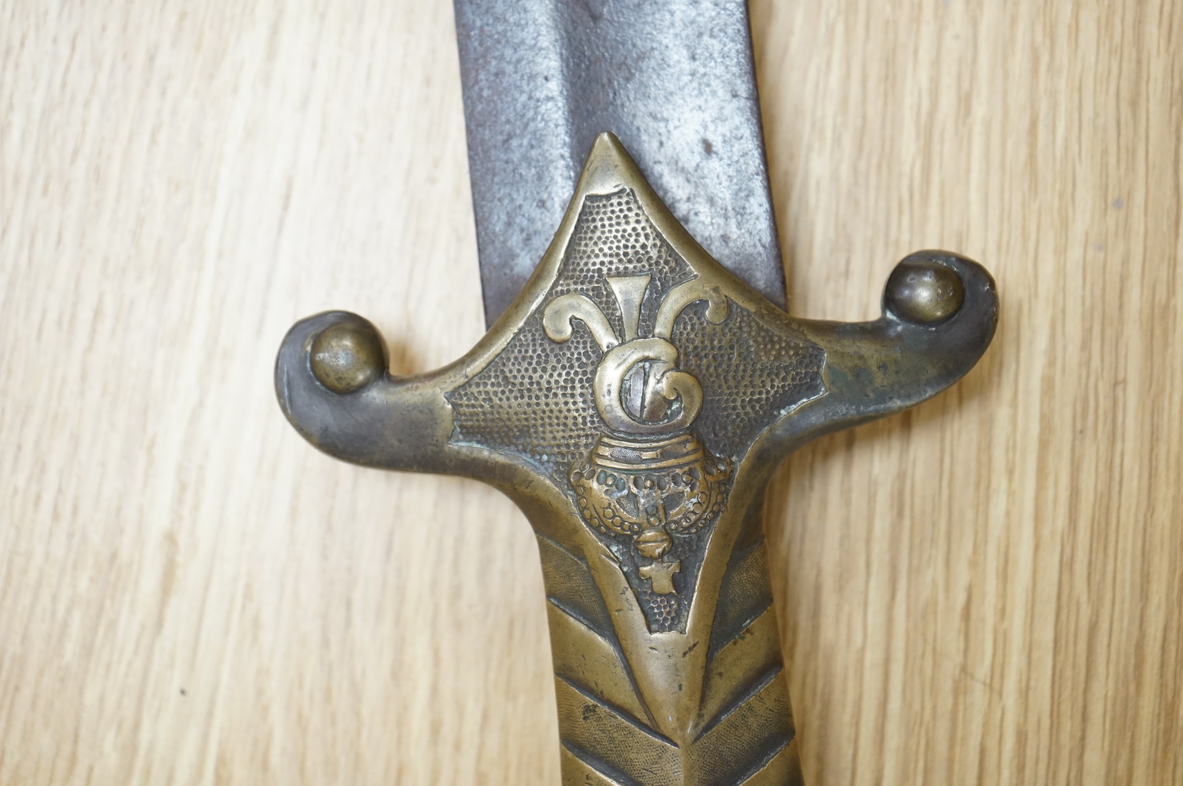 A scarce Germanic Janissary Corps sidearm, produced from 1729-31, broad single edged blade, 65cm, etched in panel with crowned cipher (faint), regulation cast brass hilt with crowned cipher and chevron grip